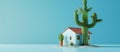A small house with a cactus in front under the clear blue sky Royalty Free Stock Photo