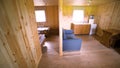 Small house interior with wooden walls and all the necessary furniture. Art. Construction trailer, modern lodging for