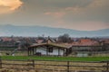 Small house with living ecological rooftop at sunset.