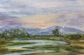 Small house, meadow, river, trees and distant hill under sunset sky. Watercolor handmade landscape painting Royalty Free Stock Photo