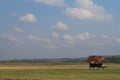 a small house in the middle of a dry rice field Royalty Free Stock Photo