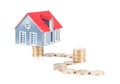 Small house model and euro coins in abstract path
