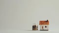 Small house model in focus with a growing line graph Royalty Free Stock Photo
