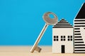 small house model with key over wooden floor. selective focus Royalty Free Stock Photo