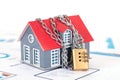 Small house model locked by chains Royalty Free Stock Photo
