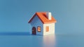 Small house model standing on blue background Royalty Free Stock Photo