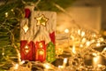 Small house model or toy house decoration on table with bokeh background. New Year mood. Comfort.