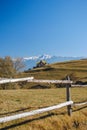 Small house, mountains and fence Royalty Free Stock Photo