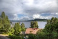 Small house near norwegian lake Royalty Free Stock Photo