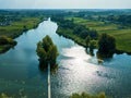 Small house one the island. Landscape with bridge to the house on lake. Old wooden fisherman`s and hunter`s house on the island. Royalty Free Stock Photo