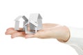 Small house from a paper in a hand Royalty Free Stock Photo