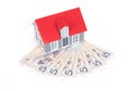 Small house on paper money Royalty Free Stock Photo