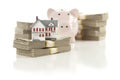 Small House and Piggy Bank with Stacks Money Royalty Free Stock Photo