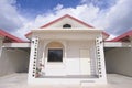 small house, red roof tiles, blue cloud sky background, a little house Royalty Free Stock Photo