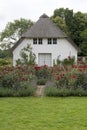 Small House in the Rose Garden Royalty Free Stock Photo