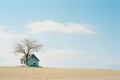 a small house sitting on top of a hill in the middle of nowhere