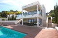 small house with a swimming pool on the shores of the Mediterran Royalty Free Stock Photo