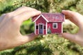 Small house in two hands nature tree green Royalty Free Stock Photo