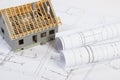 Small house under construction and electrical drawings, concept of building home Royalty Free Stock Photo