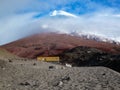 Small house with a yellow roof built in front of the Mt. Cotopaxi, Ecuador Royalty Free Stock Photo