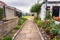 Small houses with colorful decoration in the gardens in the fishing district of Footdee, Aberdeen, UK.