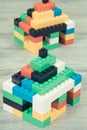 Small houses made of toy blocks. Development of kids coordination, creativity Royalty Free Stock Photo