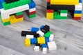 Small houses made of toy blocks. Development of kids coordination, creativity Royalty Free Stock Photo