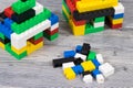 Small houses made of toy blocks. Development of kids coordination, creativity Royalty Free Stock Photo