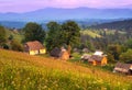 Small houses in mountain village at sunset in summer in Ukraine Royalty Free Stock Photo