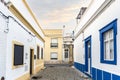 Small houses on the narrow street of historic Olhao, Algarve, Portugal