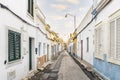 Small houses on the narrow street of historic Olhao, Algarve, Portugal