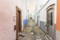 Small houses on the narrow street of historic Olhao, Algarve, Portugal