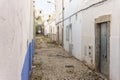 Small houses on the narrow street of historic Olhao, Algarve, Portugal