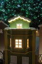 Small houses under the Christmas tree. Christmas decoration Royalty Free Stock Photo