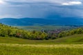 Small , hungarian transylvanian village at sunset with gathering stormclouds Royalty Free Stock Photo