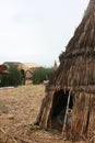 A small hut made of reeds with a opening to enter on the man made island in Lake Titicaca, Peru Royalty Free Stock Photo