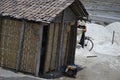 a small hut made of woven bamboo on the edge of a traditional salt mine Royalty Free Stock Photo