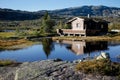 Small hut at norwegian lake in hardanger vidda