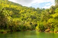 A small hut on tropical river with palm trees on both shores, Loboc Royalty Free Stock Photo