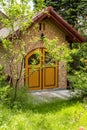 Small idyllic house in a garden during spring.