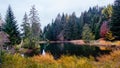 A small idyllic mountain lake near Montreux in Switzerland with beautiful autumn colors. Lac des Joncs, Les Paccots, a beautiful Royalty Free Stock Photo