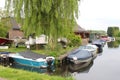 Small idyllic Dutch village Kortenhoef with boats in a canal, Netherlands