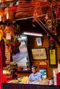 Small incense shop for prayers inside a Chinese temple, South of Vietnam Royalty Free Stock Photo