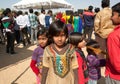 Small indian girls walking in the crowd of people