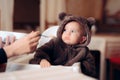 Funny Baby Sitting in Highchair Refusing to Eat Royalty Free Stock Photo