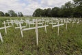 A small Impromptu memorial of white crosses to Grieve the Loss of Hundreds of Indigenous Children