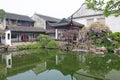 A small internal Chinese courtyard and trees. City of Shanghai. Pond in the Chinese park