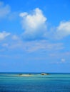 Small island in blue sea Royalty Free Stock Photo