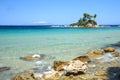 Small island with church Agios Nikolaos near Ellinika beach Royalty Free Stock Photo