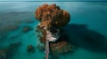 A small island with a house under the tree with blue water ocean and aerial view Royalty Free Stock Photo